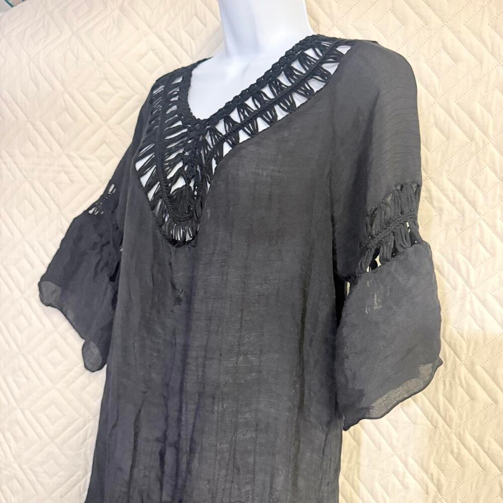 Black sheer blouse with crochet detail on front and back